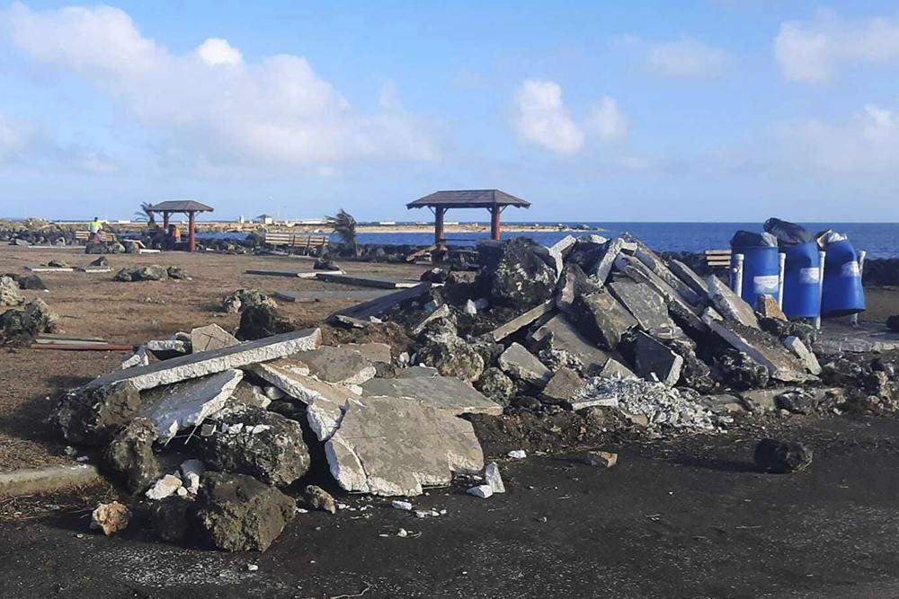 A photo of a broken up street in Tonga