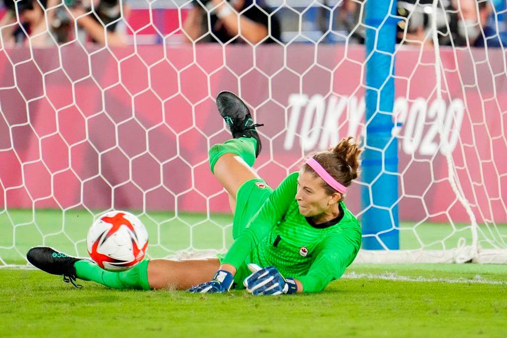 Canada's Stephanie Labbe makes a save against Sweden in the sixth round of the penalty shoot-out in the women's soccer final during the summer Tokyo Olympics in Yokohama, Japan on Friday, August 6, 2021.