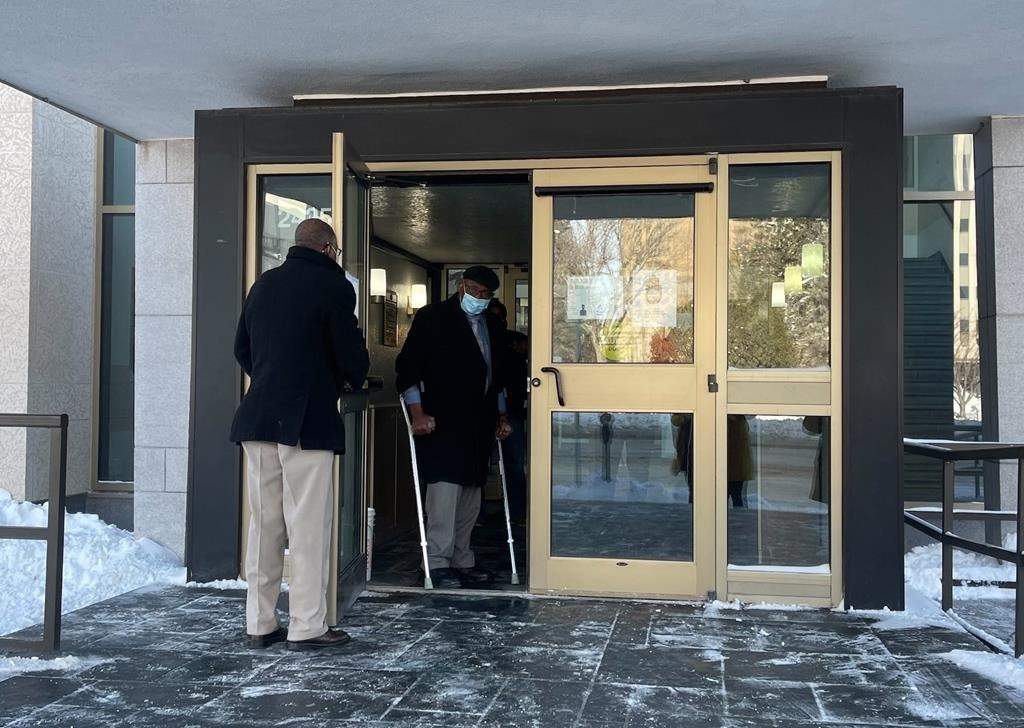 Sylvester Ukabam (right) is shown at Court of Queen's Bench in Regina on Monday, Jan.10, 2022. Ukabam, a 76-year-old former doctor, is accused of sexual assaulting seven of his patients during medical exams between 2010 and 2017.  He pleaded not guilty to all counts on the first day of his trial. THE CANADIAN PRESS/Mickey Djuric.