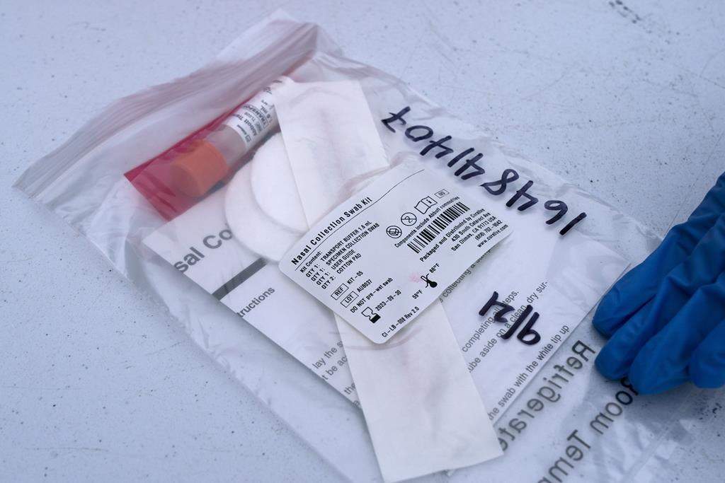 A PCR test is prepared to test for COVID-19, Tuesday, Dec. 21, 2021.