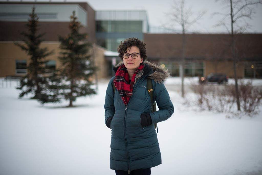 Mary Fraser-Hamilton, a teacher in Brampton, Ont., poses for a photograph outside of her school, on Monday, January 24, 2022.