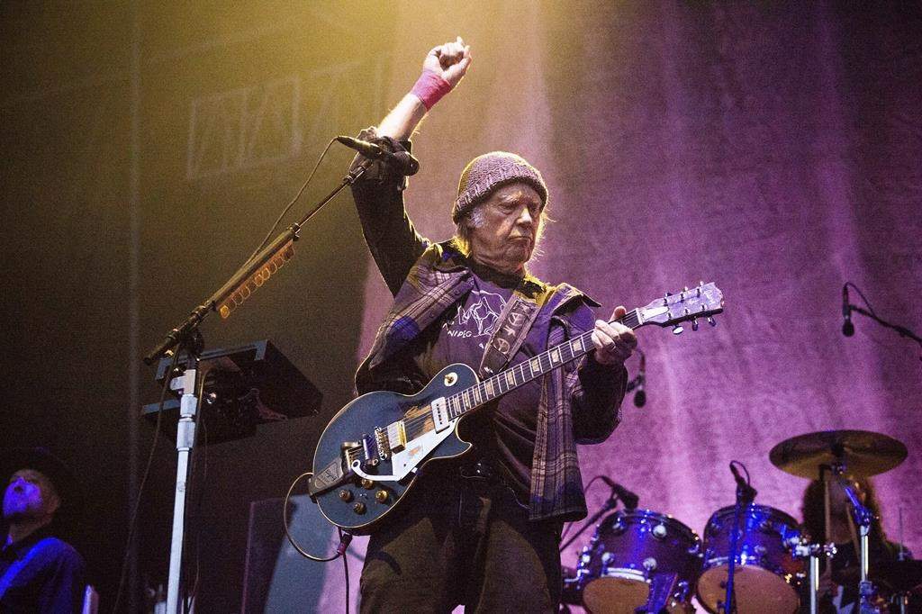 FILE - In this May 25, 2019, photo, Neil Young performs at the BottleRock Napa Valley Music Festival at Napa Valley Expo in Napa, Calif. (Photo by Amy Harris/Invision/AP, File).