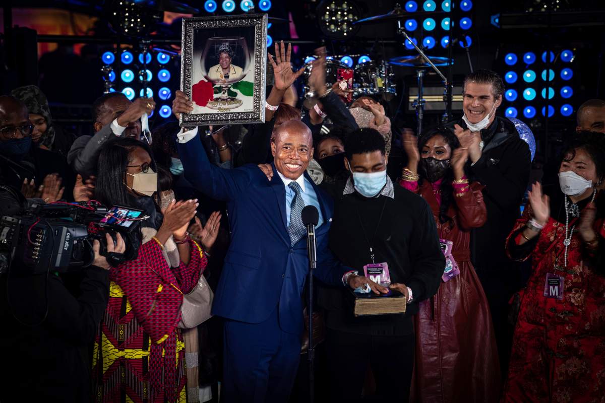 Eric Adams is sworn in as mayor of New York City on the stage of the New Year\’s Eve celebration in New York\’s Times Square on Saturday, Jan. 1, 2022. (AP Photo/Robert Bumsted)