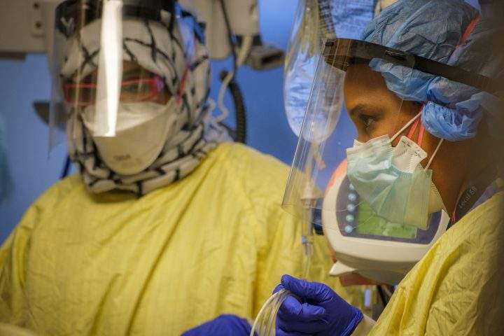 A nurse care for an unvaccinated COVID-19 patient in the Intensive Care Unit at Humber River Hospital.