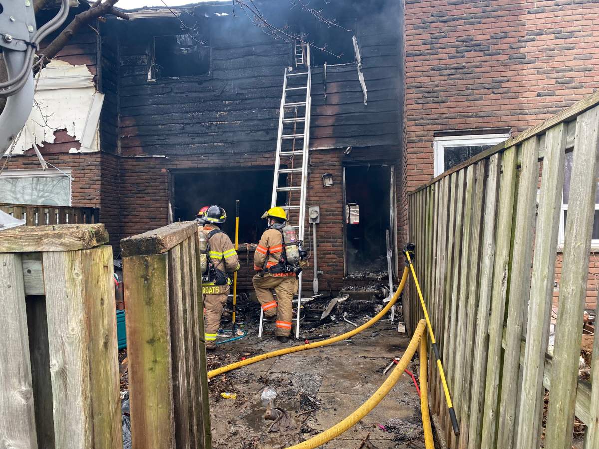 Fire crews were called to 127 Toulon Crescent, a townhouse in east London, around 10:30 a.m. Saturday.