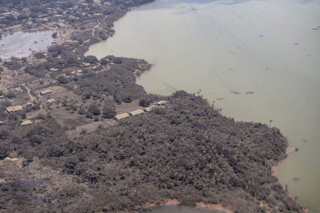 An aerial photo shows a blanket of ash covering parts of Tonga.