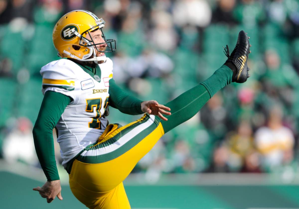 Edmonton kicker Hugh O'Neill delivers a punt vs. the Riders