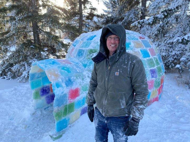 Cody Shepherd with his ‘rainbow igloo’ on his property just north of Calgary on Tuesday, January 4, 2022.