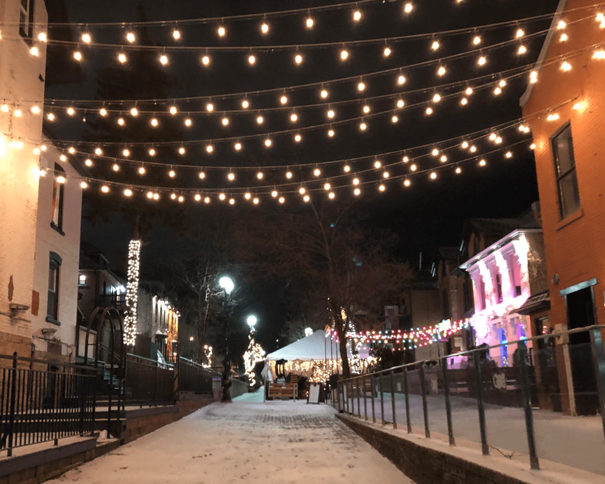 George Street lit up at night, with Electric Diner’s outdoor patio.