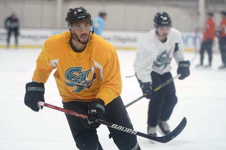 San Jose Barracuda’s Evander Kane, left, skates during a hockey practice in San Jose, Calif., Tuesday, Nov. 30, 2021. Kane reported to the San Jose Sharks’ minor league affiliate for the first time since serving a suspension for submitting a fake COVID-19 vaccination card.