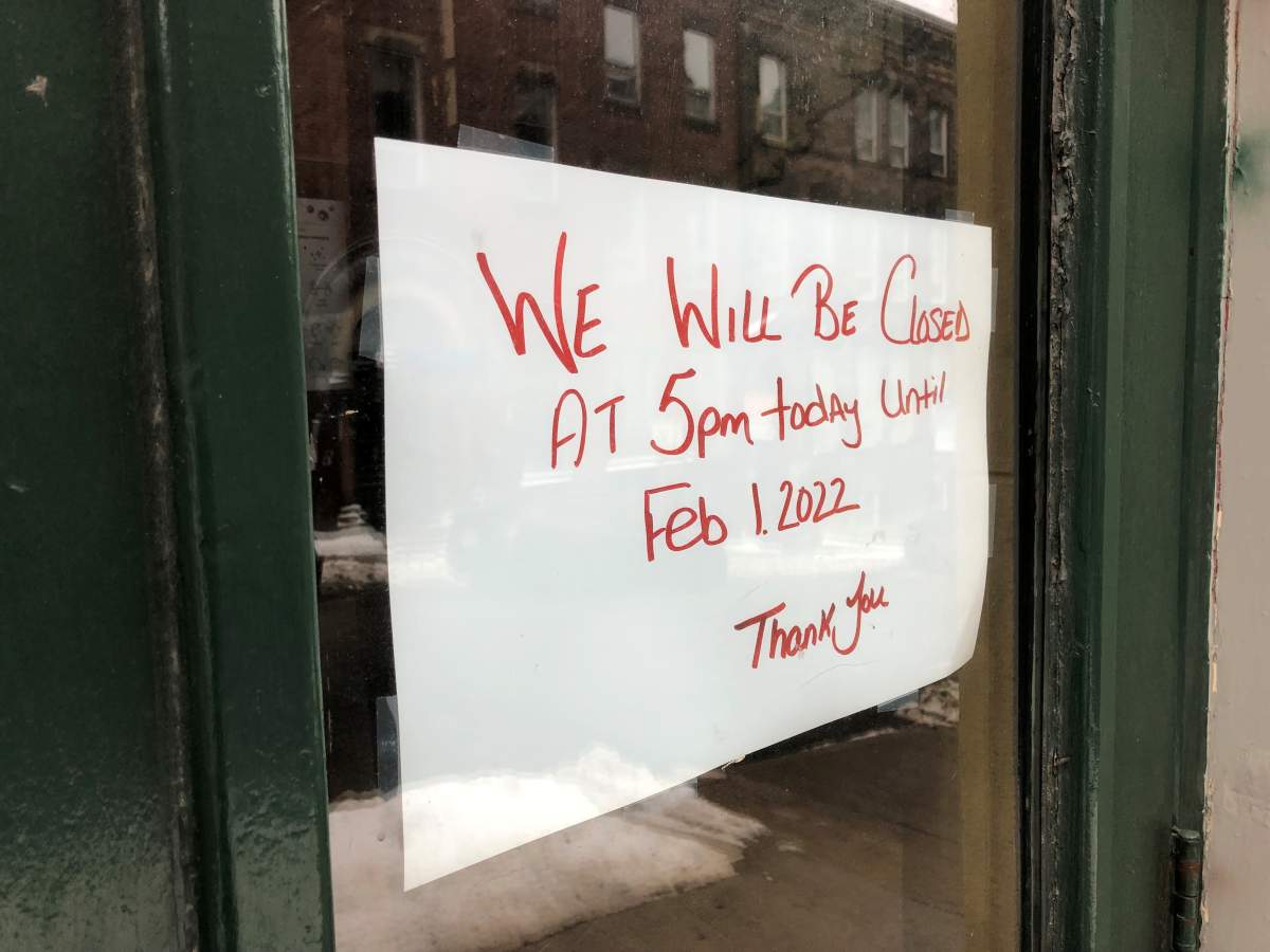 A hand-written sign on the outside door of O’Leary’s Pub in Saint John, N.B., announcing that the establishment will be closed under the province’s Level 3 COVID-19 restrictions.