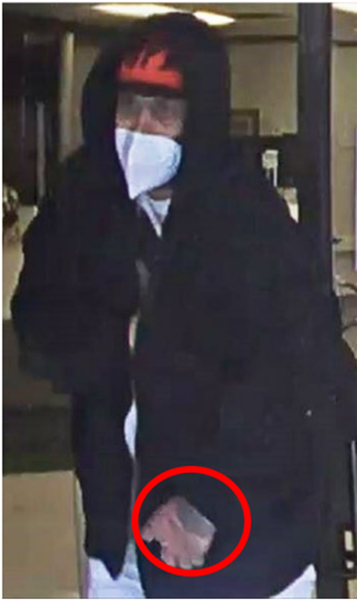 Police note the suspect has a tattoo on the back of his hand.
