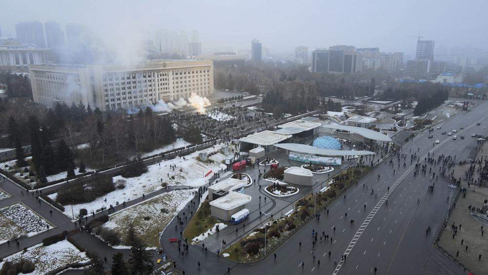 Smoke rises from the city hall building during a protest in Almaty, Kazakhstan, Wednesday, Jan. 5, 2022.