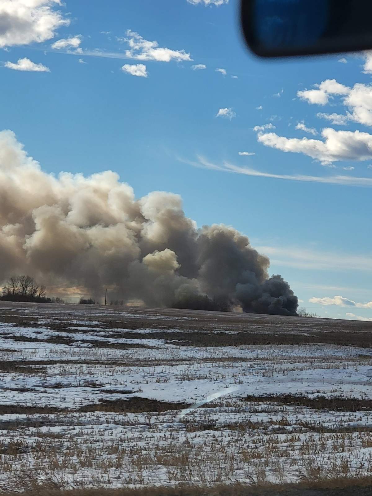 Fire crews battle a blaze at Highline Mushrooms north of Calgary Sunday, Jan. 23, 2022.
