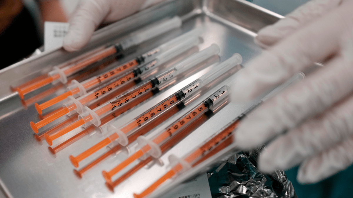 Syringes with the Pfizer vaccine against COVID-19 disease are seen at a vaccination center in the complex of the Tokyo Skytree, the tallest structure in Japan, Thursday, Jan. 6, 2022,.