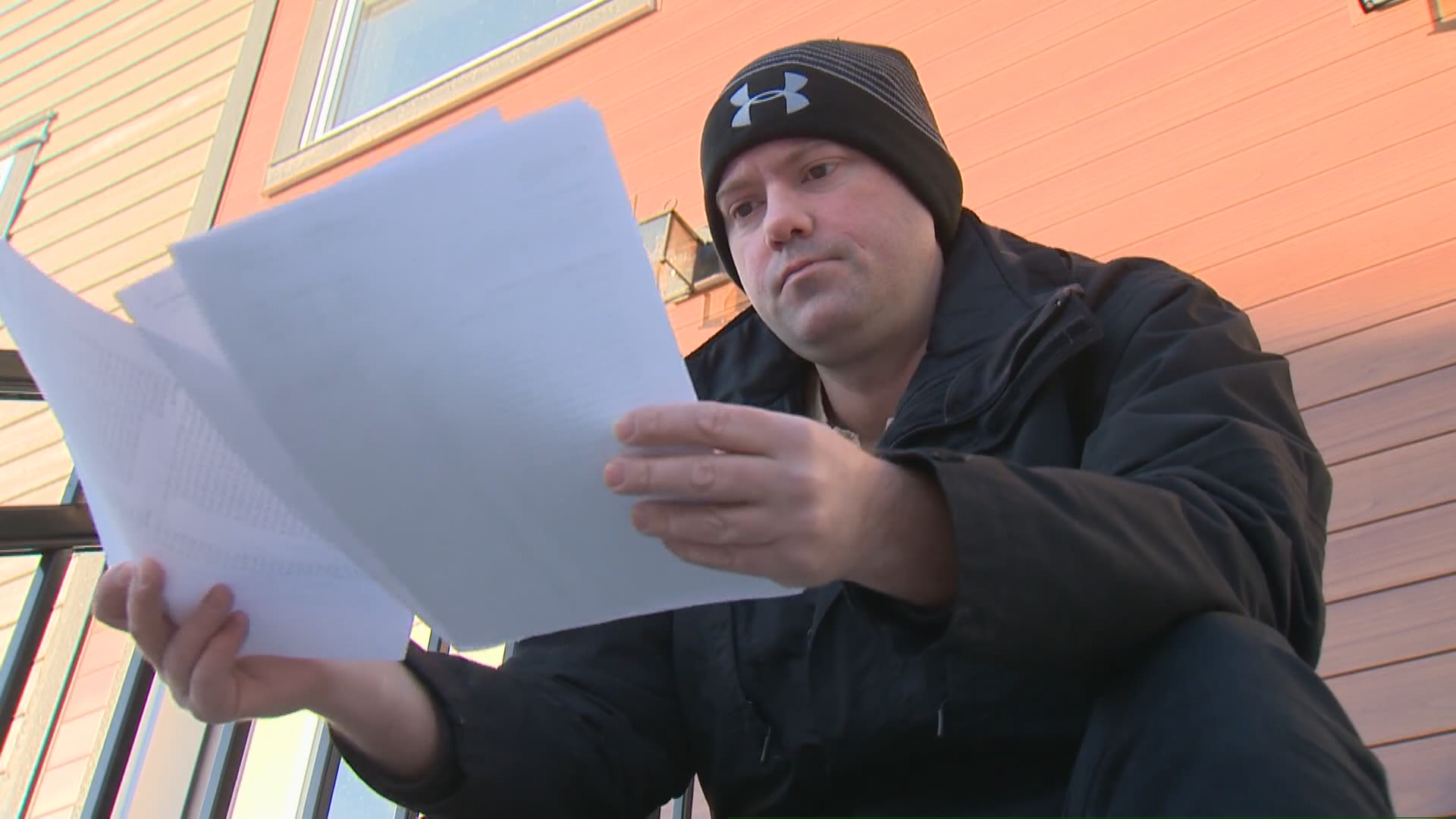 Laurie Richards looks over a shocking utility bill