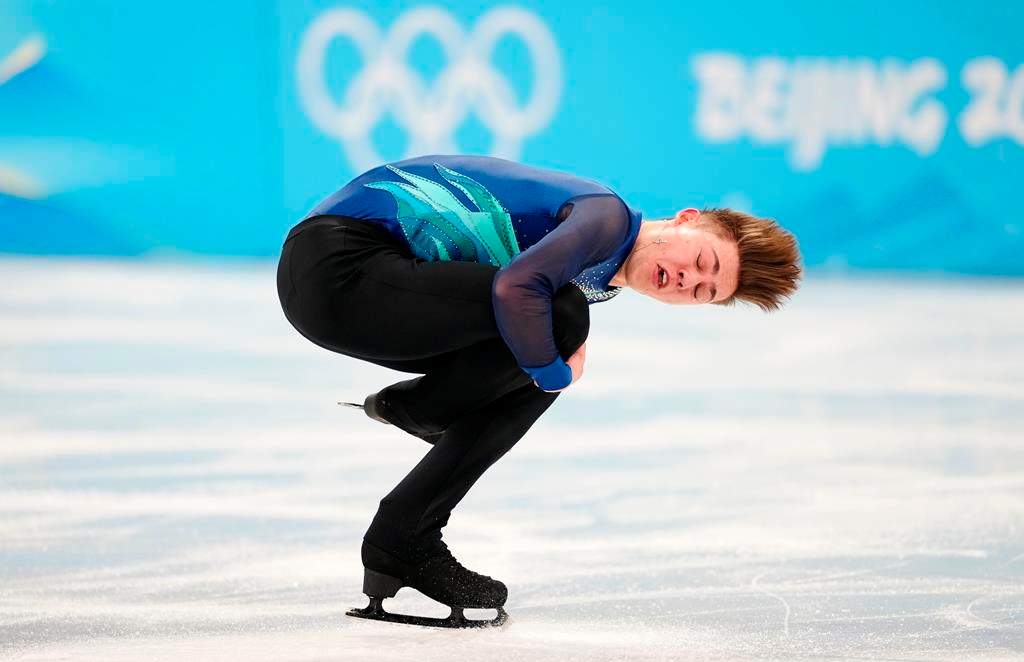 Canada’s Roman Sadovsky competes during the men’s singles short program portion of the figure skating team event at the 2022 Winter Olympics in Beijing on Friday, Feb. 4, 2022.