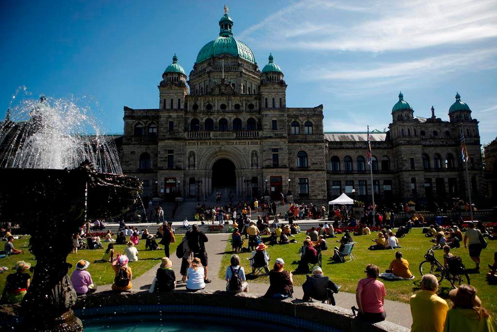 People honour Chantel Moore during a healing gathering at the B.C. Legislature in Victoria on Thursday, June 18, 2020. A coroner’s inquest into the police shooting of the 26-year-old Indigenous woman has been delayed until May. THE CANADIAN PRESS/Chad Hipolito