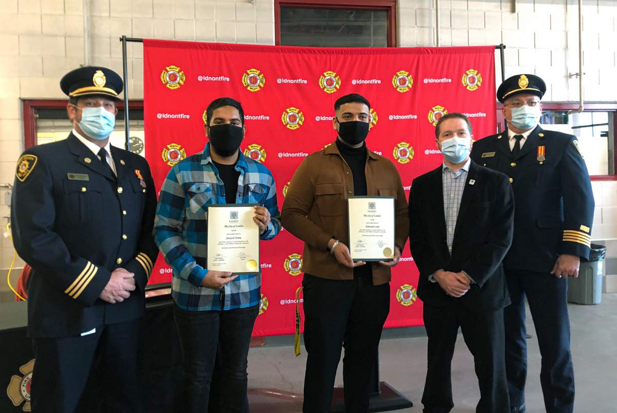 (From left to right): Platoon Chief Gary Mosburger, Avinash Verma, Yadvinder Saini, Deputy Mayor Josh Morgan, District Chief Richard Hayes.