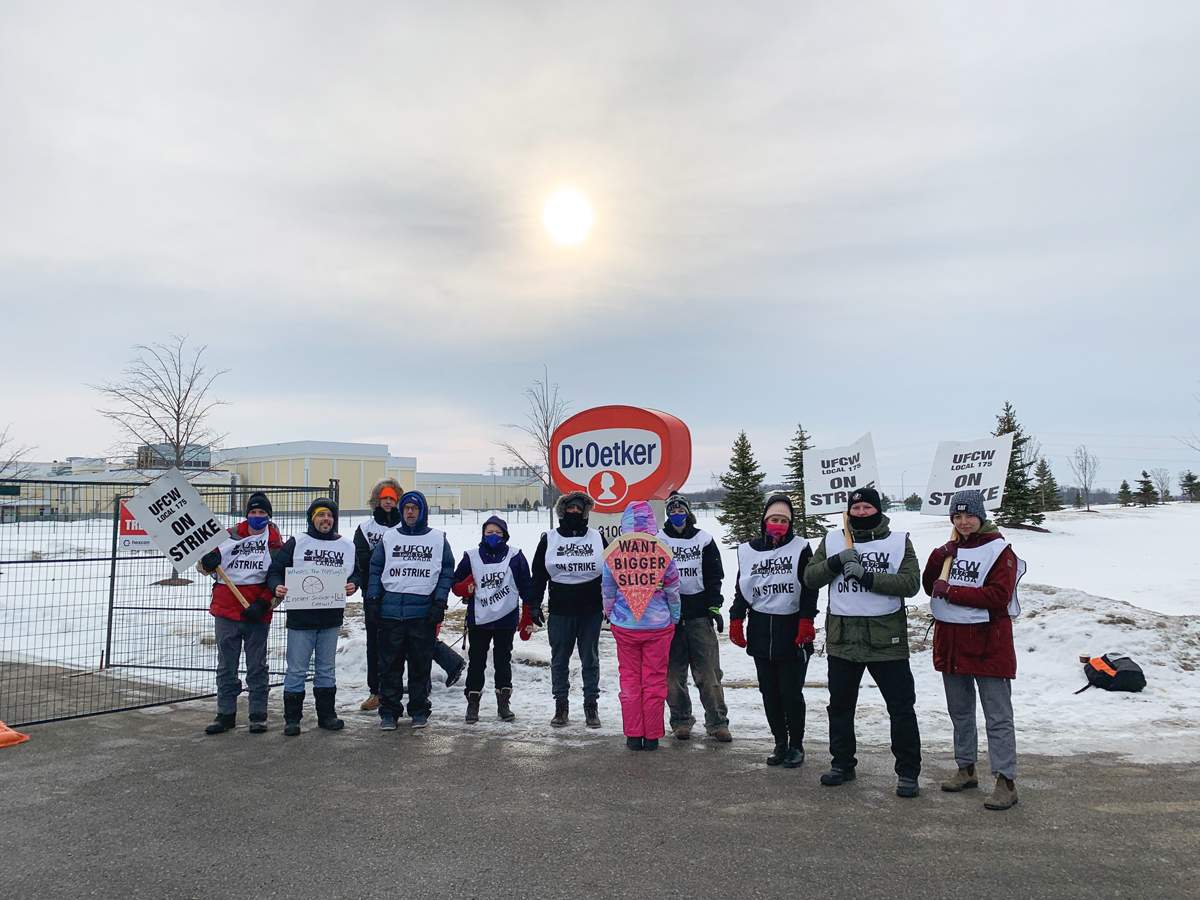 Striking members of UFCW Local 157 outside of the Dr. Oetker plant in London, Ont. on Feb. 16, 2022.