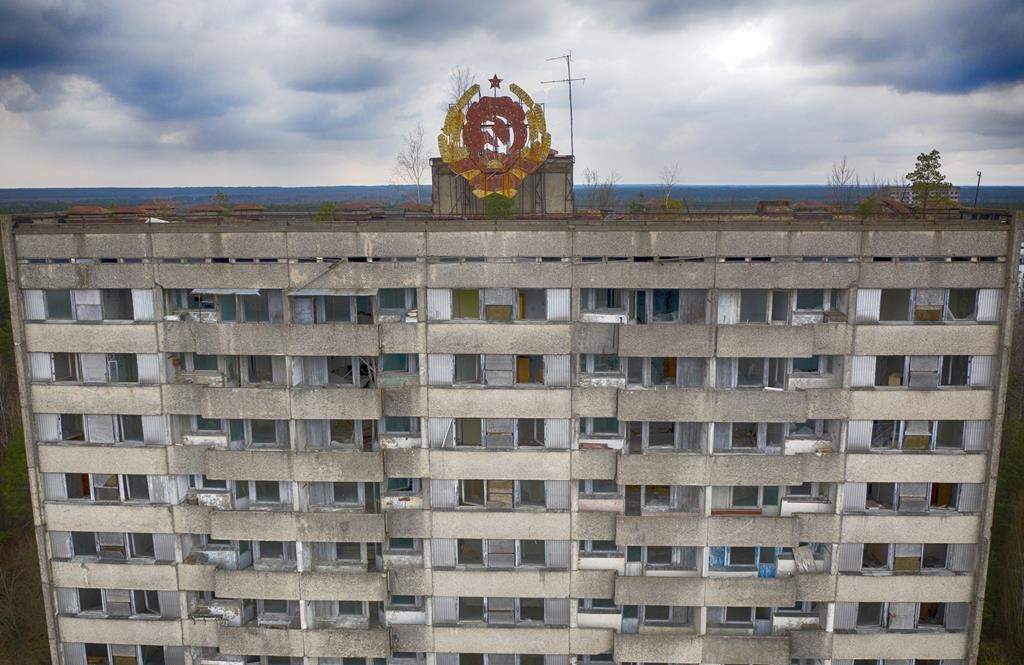 The rusty emblem of the Soviet Union is seen on the roof of an apartment building in the ghost town of Pripyat close to the Chornobyl nuclear plant, Ukraine, on April 15, 2021.