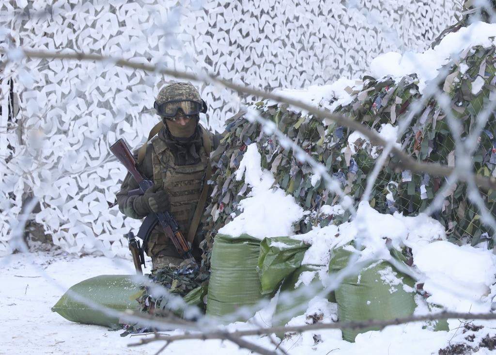 The National Guard soldiers take part in tactical exercises, which are conducted by the Ukrainian National Guard, Armed Forces, special operations units and simulate a crisis situation in an urban settlement, in the abandoned city of Pripyat near the Chornobyl Nuclear Power Plant, Ukraine, Friday, Feb. 4, 2022.