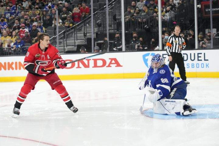 Tampa Bay Lightning goalie Andrei Vasilevskiy, right, and Calorina Hurricanes’ Sebastian Aho participate in the Skills Competition save streak event, part of the NHL All-Star weekend, Friday, Feb. 4, 2022, in Las Vegas.