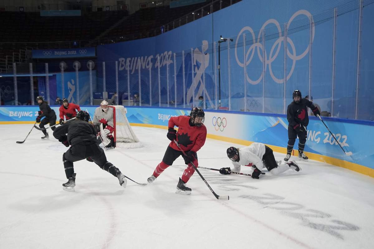 Members of the Canada women's hockey team practice at the 2022 Winter Olympics, Sunday, Jan. 30, 2022, in Beijing. (AP Photo/Jeff Roberson).