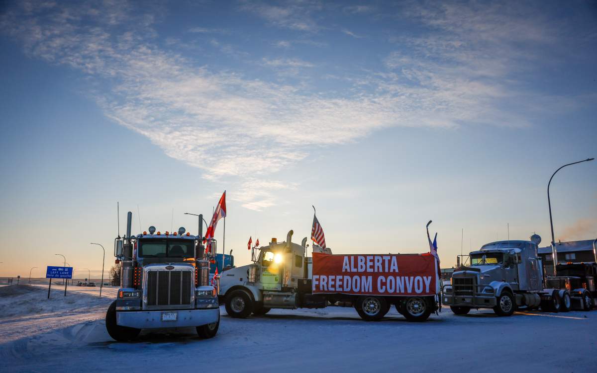 A truck convoy of anti-COVID-19 vaccine mandate demonstrators continue to block the highway at the busy U.S. border crossing in Coutts, Alta., Wednesday, Feb. 2, 2022.