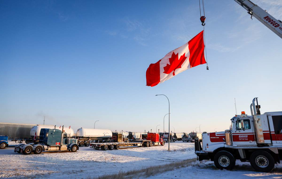 A truck convoy of anti-COVID-19 vaccine mandate demonstrators continue to block the highway at the busy U.S. border crossing in Coutts, Alta., Wednesday, Feb. 2, 2022.