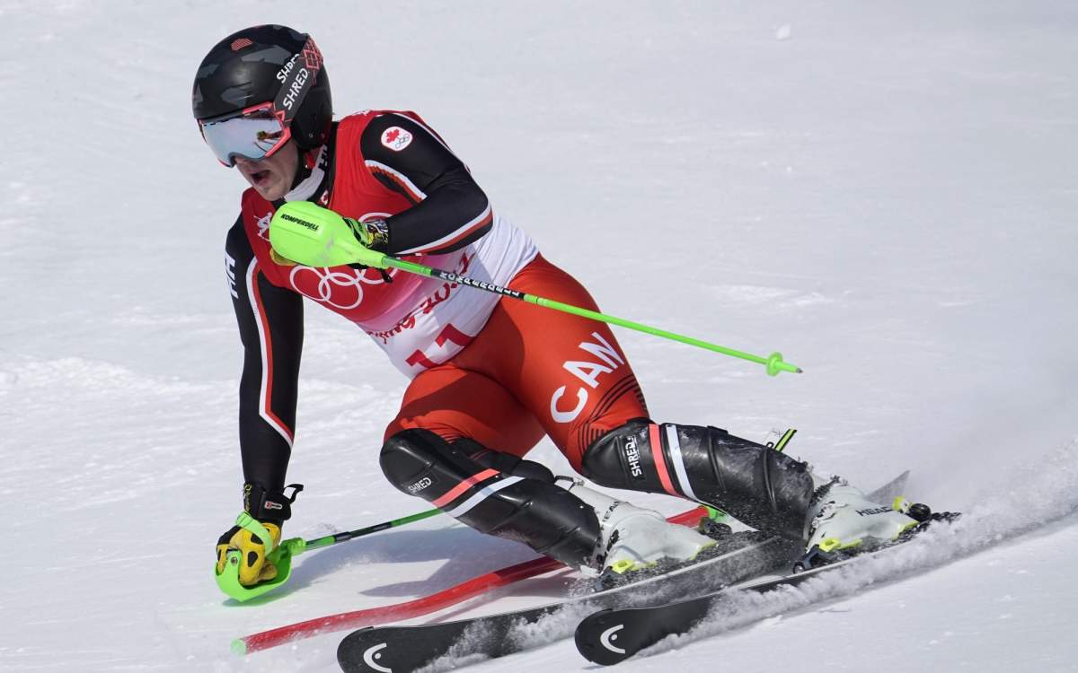 James Crawford, of Canada, passes a gate during the slalom part of the men’s combined at the 2022 Winter Olympics on Feb. 10 in the Yanqing district of Beijing.