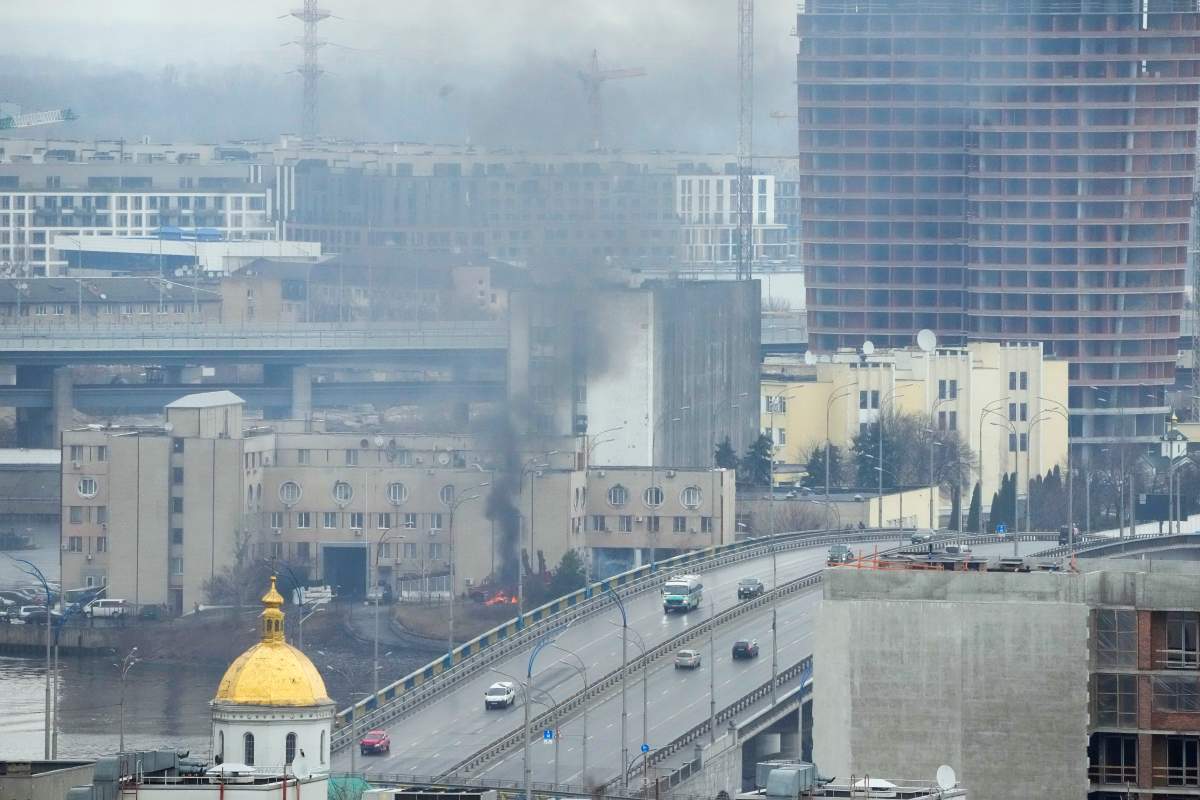 Smoke and flame rise near a military building after an apparent Russian strike in Kyiv, Ukraine, Thursday, Feb. 24, 2022. Russian troops have launched their anticipated attack on Ukraine. Big explosions were heard before dawn in Kyiv, Kharkiv and Odesa as world leaders decried the start of an Russian invasion that could cause massive casualties and topple Ukraine's democratically elected government.