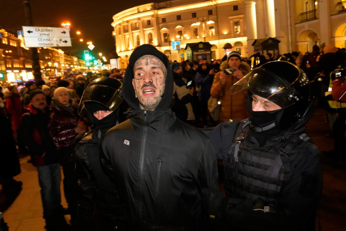 Police officers detain a demonstrator during a gathering in St. Petersburg, Russia, Thursday, Feb. 24, 2022, after Russia’s attack on Ukraine. Hundreds of people gathered in the center of Moscow on Thursday, to protest against Russia’s attack on Ukraine and many of the demonstrators were detained. Similar protests took place in other Russian cities, where activists were also arrested.