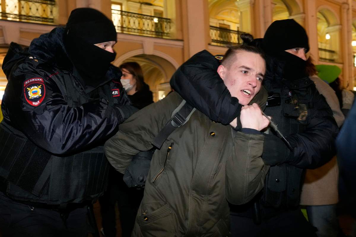 Police officer detain a demonstrator during an action against Russia’s attack on Ukraine in St. Petersburg, Russia, Thursday, Feb. 24, 2022. Hundreds of people gathered in the center of Moscow on Thursday, protesting against Russia’s attack on Ukraine. Many of the demonstrators were detained. Similar protests took place in other Russian cities, and activists were also arrested.