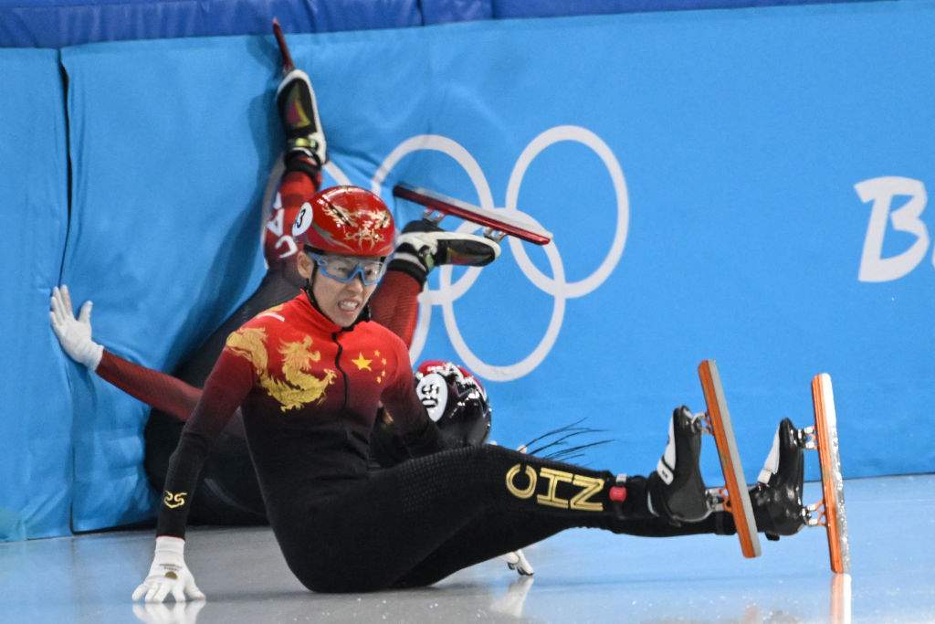 China's Fan Kexin falls in a quarter-final heat of the women's 500m short track speed skating event during the Beijing 2022 Winter Olympic Games at the Capital Indoor Stadium in Beijing on February 7, 2022.
