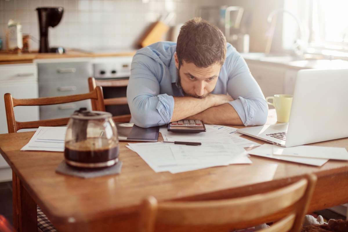 Photo of a man going through his financials problems