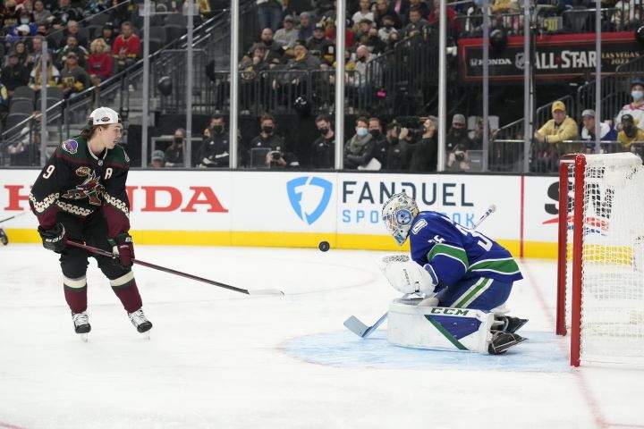 Vancouver Canucks goalie Thatcher Demko, right, and Phoenix Coyotes’ Clayton Keller participate in the Skills Competition save streak event, part of the NHL All-Star weekend, Friday, Feb. 4, 2022, in Las Vegas.