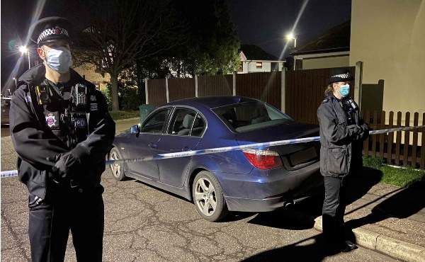 A photograph showing police at the scene.