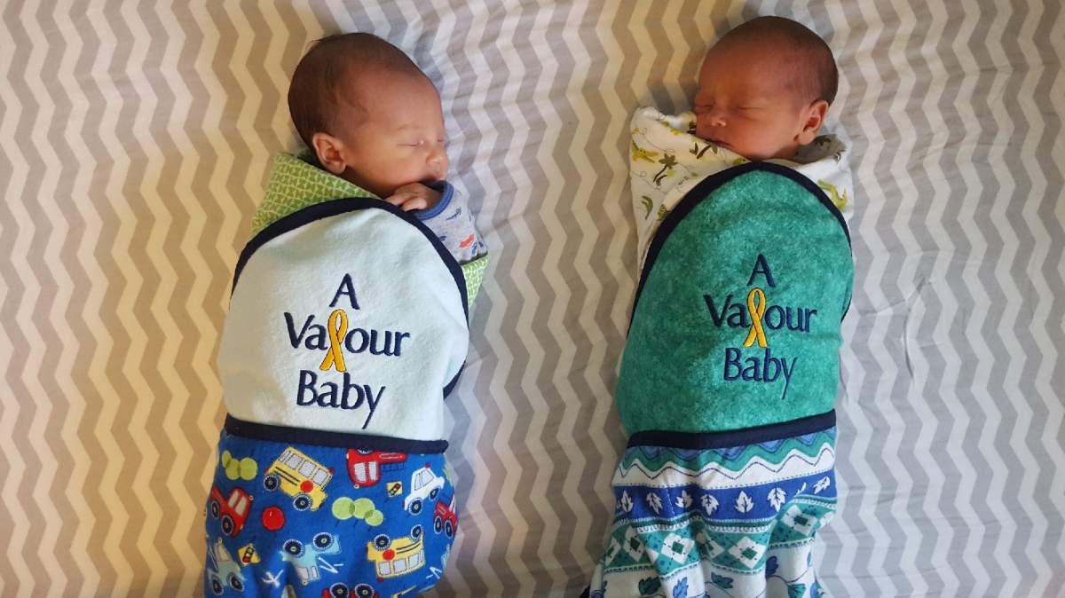 Twin baby boys are wrapped in Valour Baby blankets at Valour Place in Edmonton, Alta.