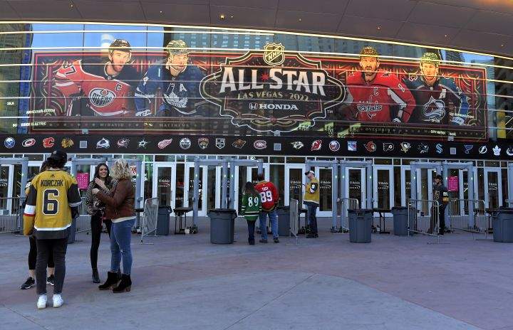 Fans line up before an NHL hockey game between the Vegas Golden Knights and the Buffalo Sabres at T-Moblie Arena Tuesday, Feb. 1, 2022, in Las Vegas. The arena is the site for this year’s NHL All-Star game.