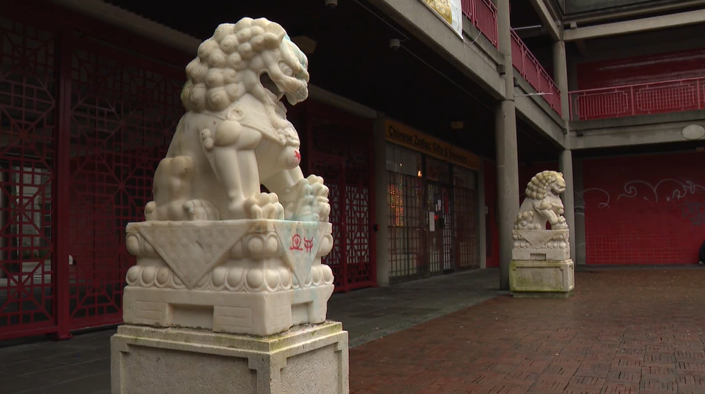 A pair of lion statues outside the Vancouver Chinese Cultural Centre have been defaced by graffiti.
