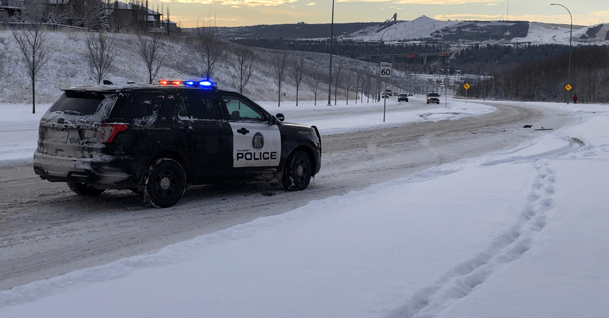 A Calgary police vehicle parked on the side of a road near Nose Hill after reports of gun shots in the morning of Feb. 16, 2022.