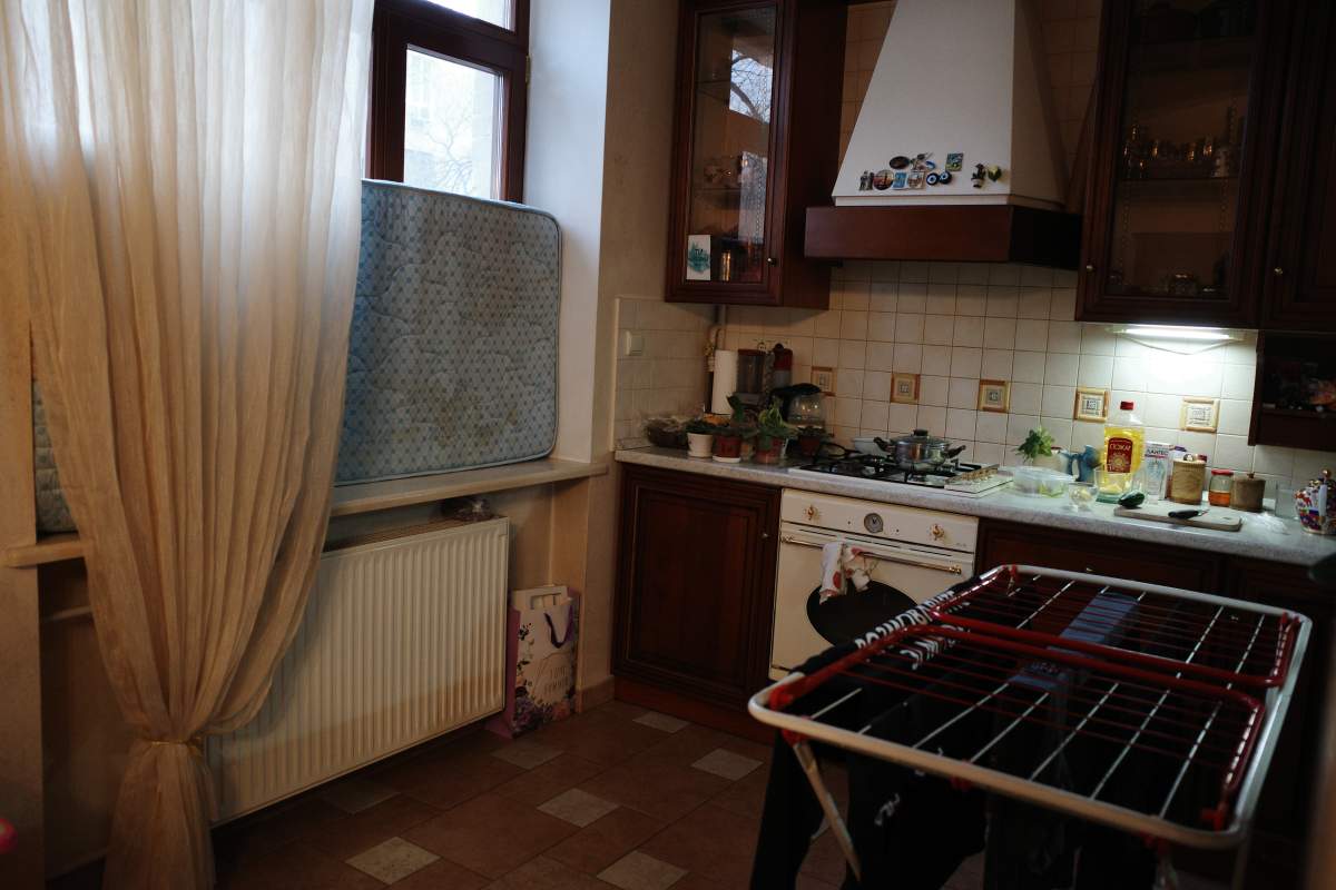 A mattress propped up against a window shields a Ukrainian family from the risk of shattered glass in an explosion as Russia continues its violent and unprovoked incursion.