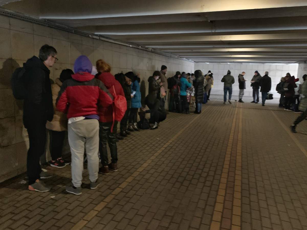 Ukrainians take shelter in an underground street crossing during an air strike warning while fleeing the capital, Kiev.