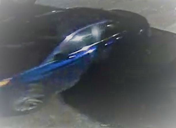 A sedan was seen arriving and leaving the scene of the theft of the truck and trailer carrying firearms.