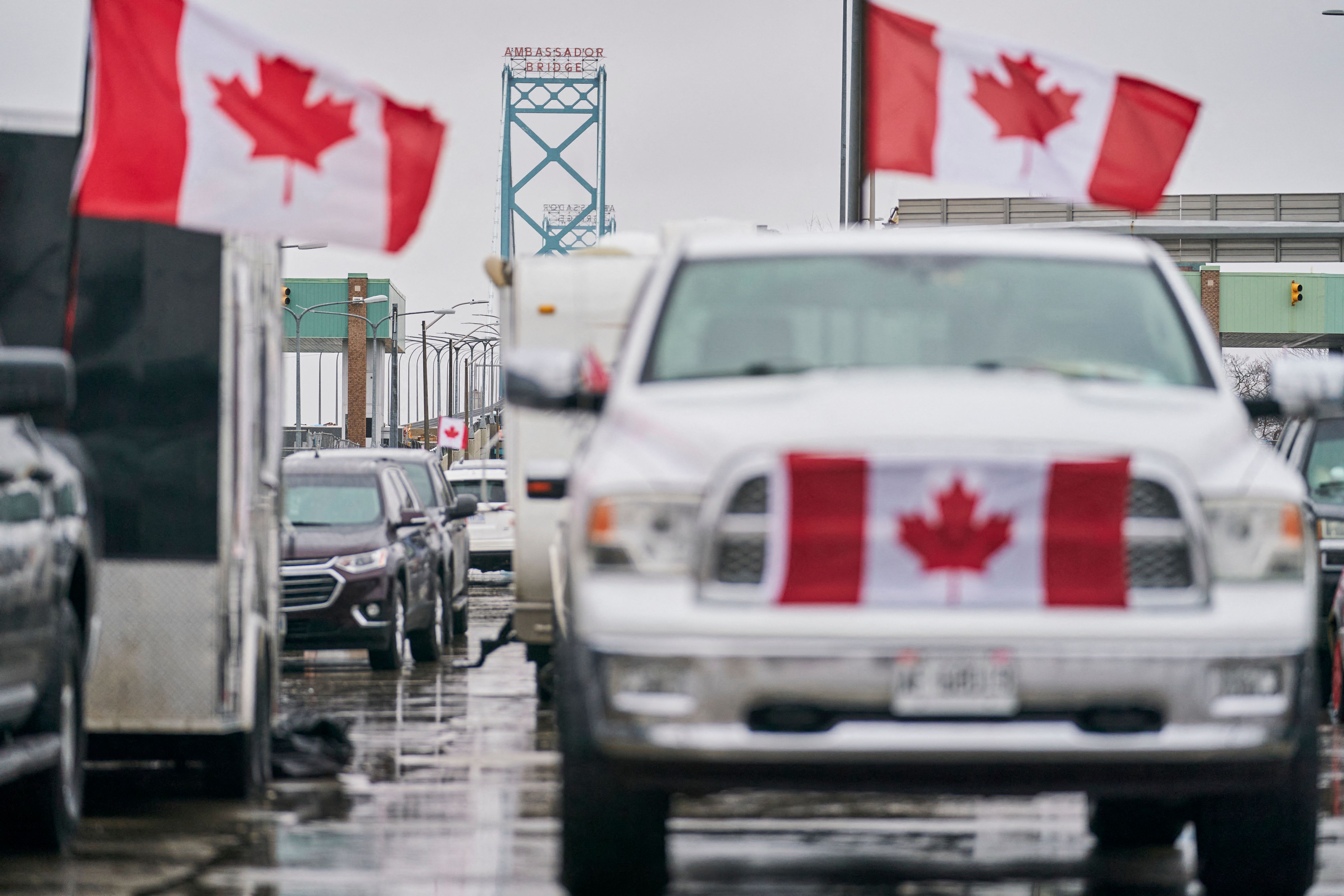 Anti-vaccine mandate protestors block the roadway at the Ambassador Bridge border crossing, in Windsor, Ont., on Feb. 11, 2022. (Geoff Robins / AFP)