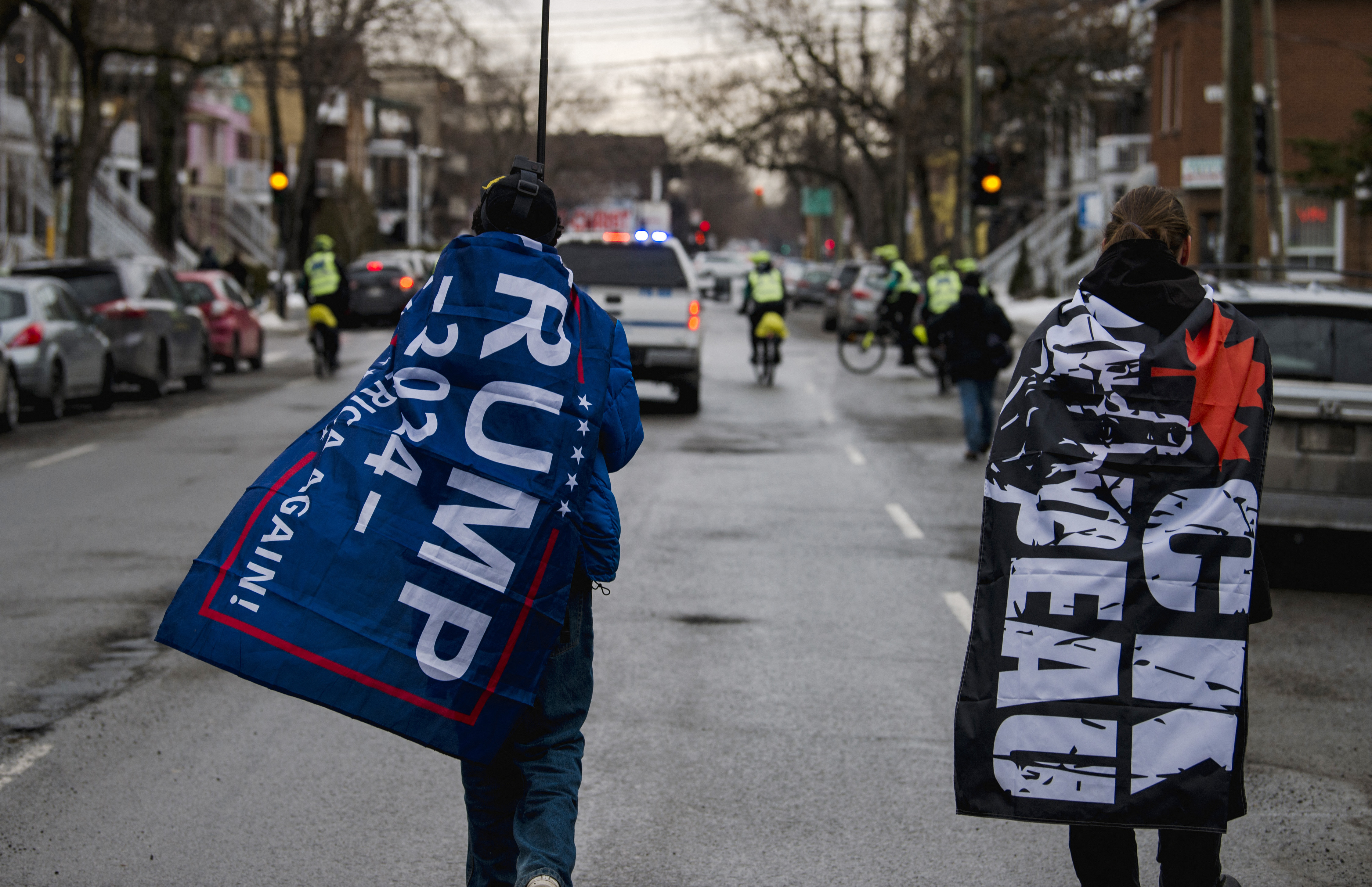 Demonstrators march to support the Trucker Convoy protesting COVID-19 mandates, in Montreal on Feb. 12, 2022.