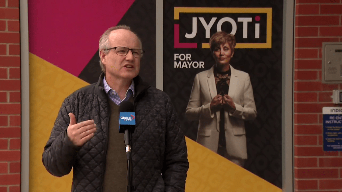 Stephen Carter standing in front of the Jyoti Gondek campaign headquarters