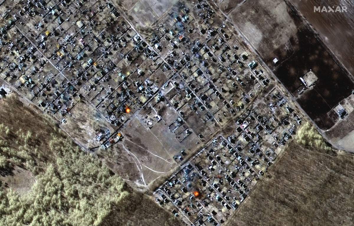 This satellite image shows destroyed homes, impact craters and fires in the town of Moschun, Ukraine, on March 11, 2022.