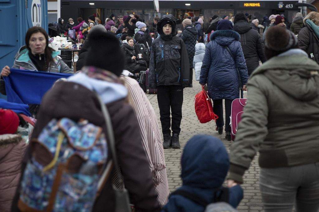 Refugees, mostly women with children, arrive at the border crossing in Medyka, Poland on Sunday, March 6, 2022.